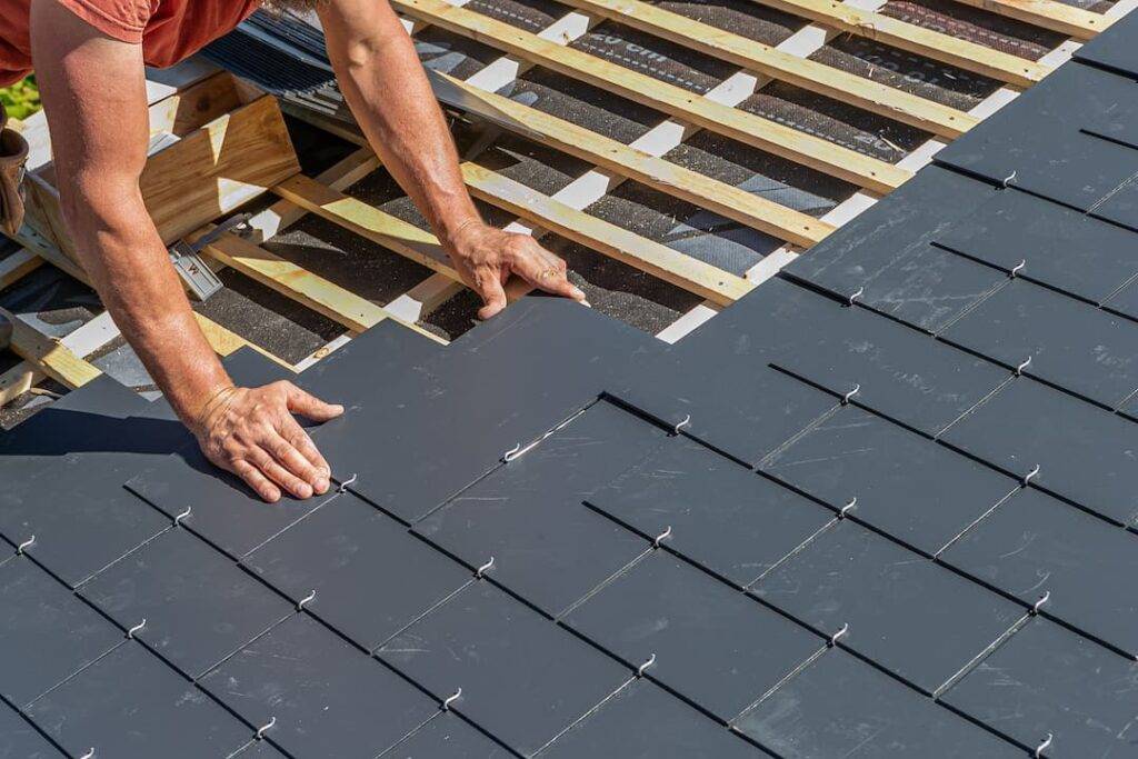 roofer installing slate roofing