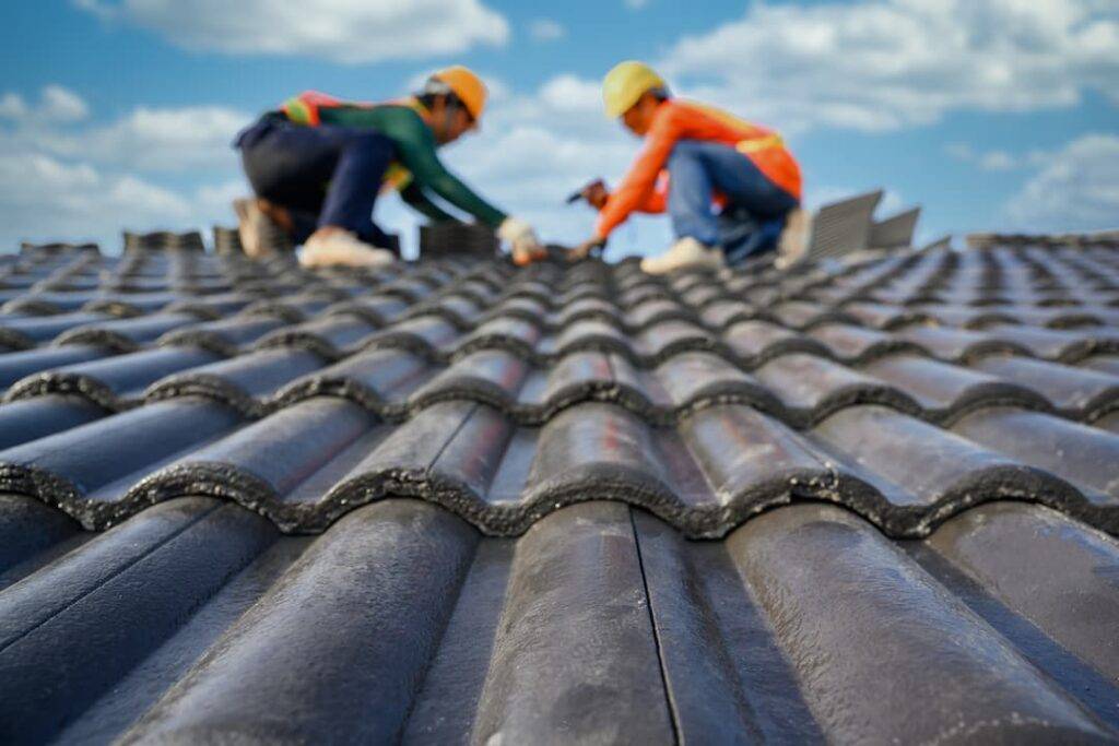 roofers working on tiled roofing
